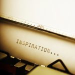 the word "inspiration" typed on a typewriter