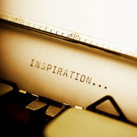the word inspiration written on a typewriter