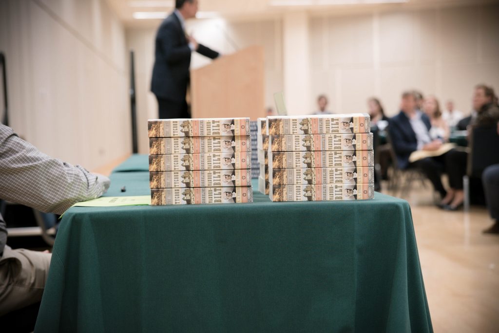 stack of books at T.J. Stiles speaking event
