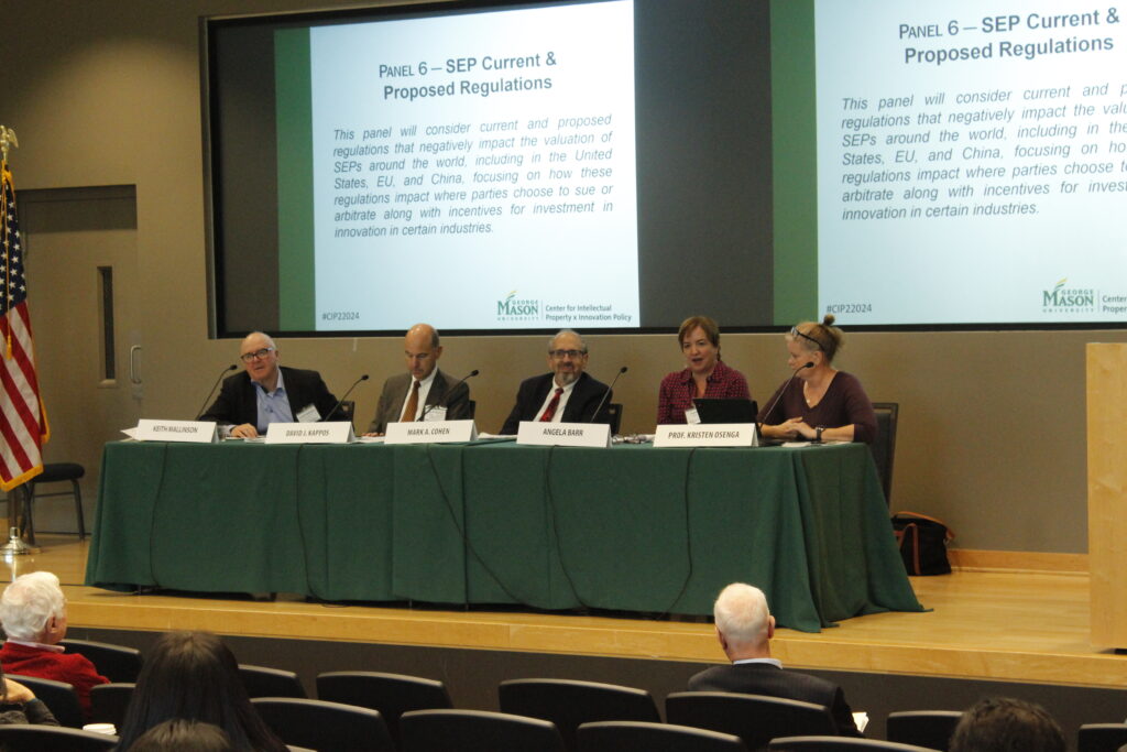 Photo of one of the Fall Conference panels in the Mason Square Auditorium